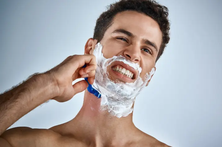 Smear lip balm over shaving nicks